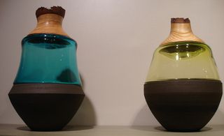 Side by side stacking vessels - left has green tinted glass and right has clear glass.