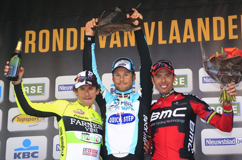 Tom Boonen holds aloft the 2013 Tour of Flanders trophy, his third