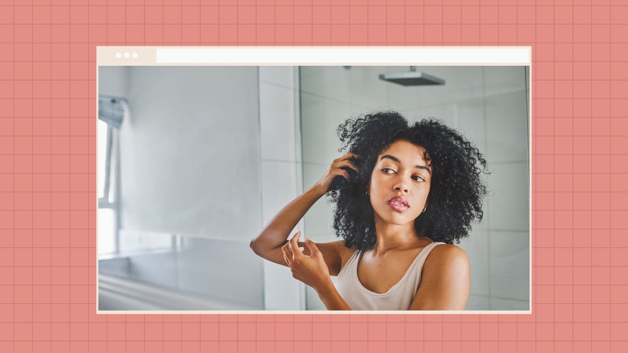 woman looking at her skin in the mirror