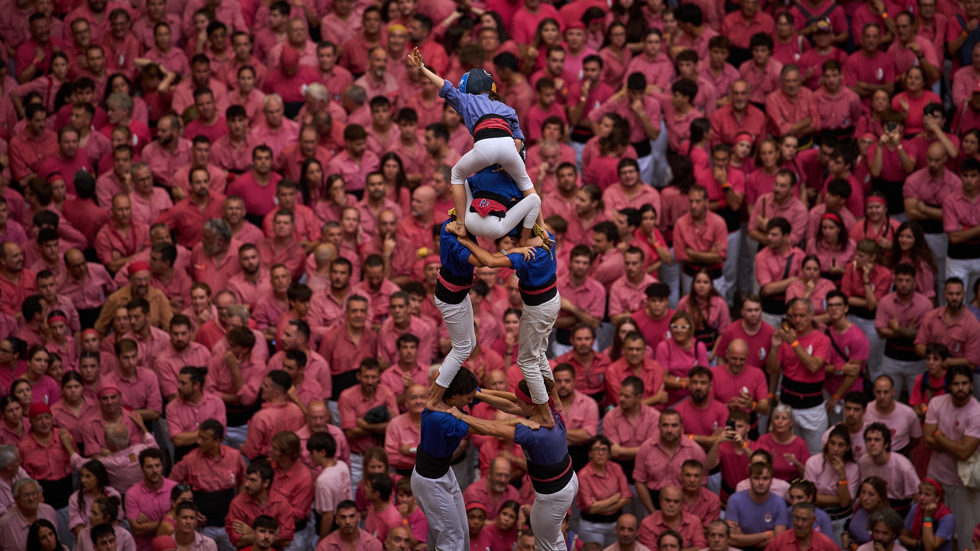 Members of Castellers de la Vila de Gr&amp;agrave;cia form a "castell", or human tower, during the 30th Concurs de Castells in Tarragona, Spain