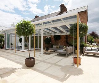 white lean to conservatory with extended roof to side
