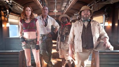 Karen Gillan, Dwayne Johnson, Kevin Hart and Jack Black on a train in Jumanji: Open World