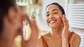 woman applying face cream