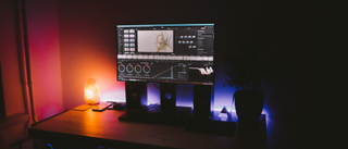 Video editing software on a computer in a dark home studio