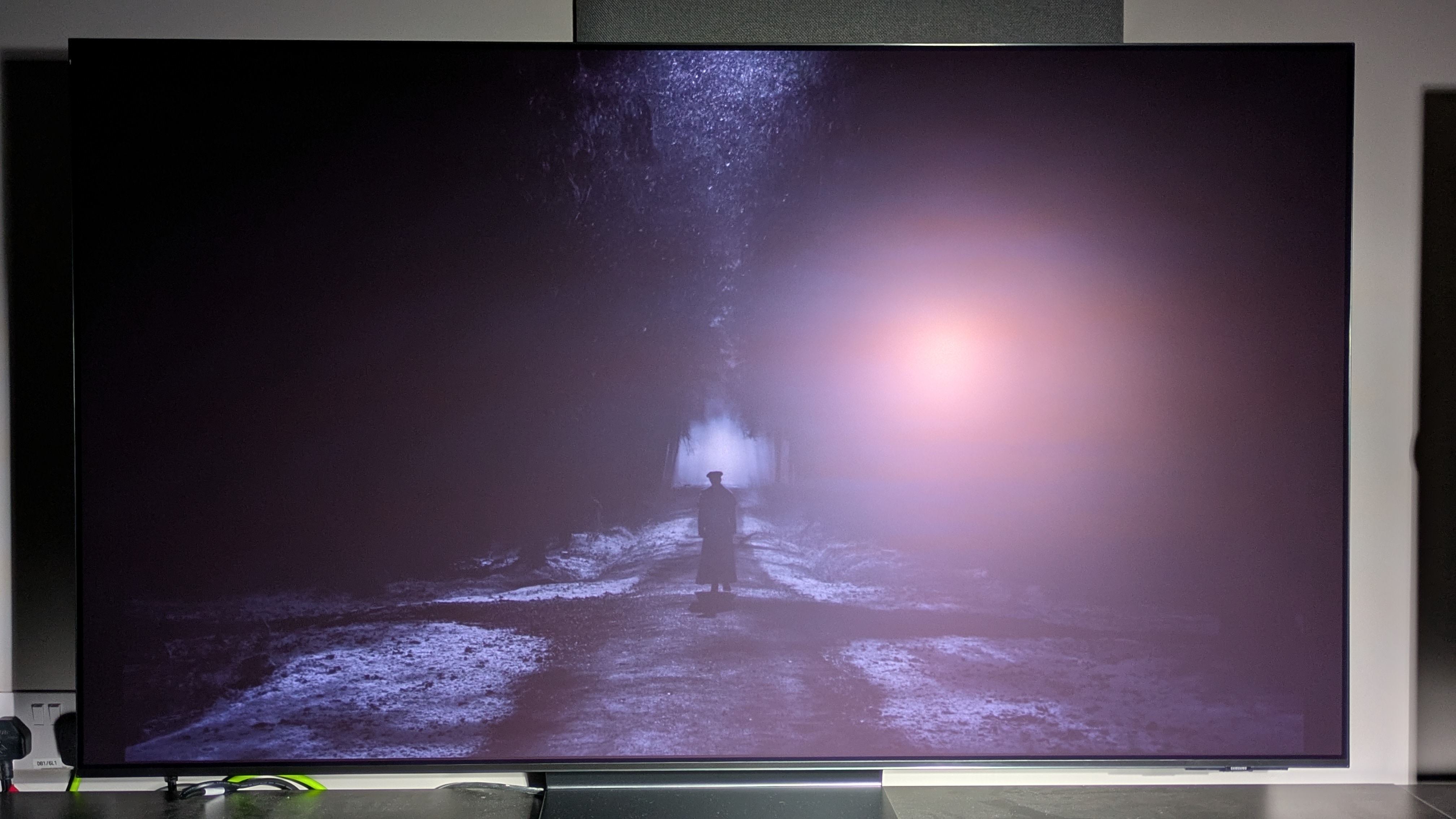 Samsung S95G with Nosferatu on screen with spotlight aimed at screen