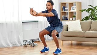 Man in the bottom squat position