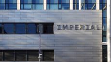 Imperial London College South Kensington campus pictured during daylight with 'Imperial' emblazoned on side of building.