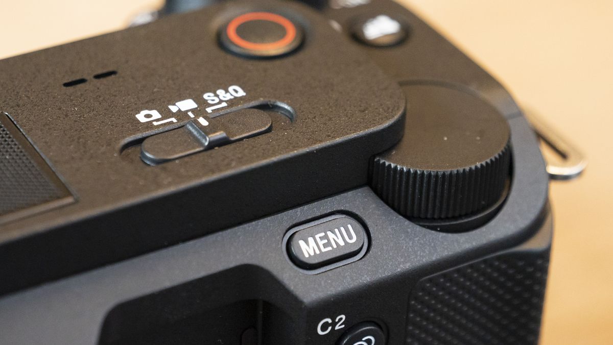 The Sony ZV-E1 camera sitting on a wooden table