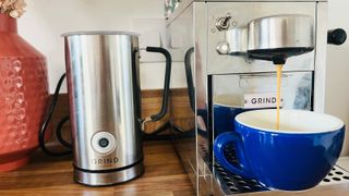 Grind coffee maker running coffee into cup