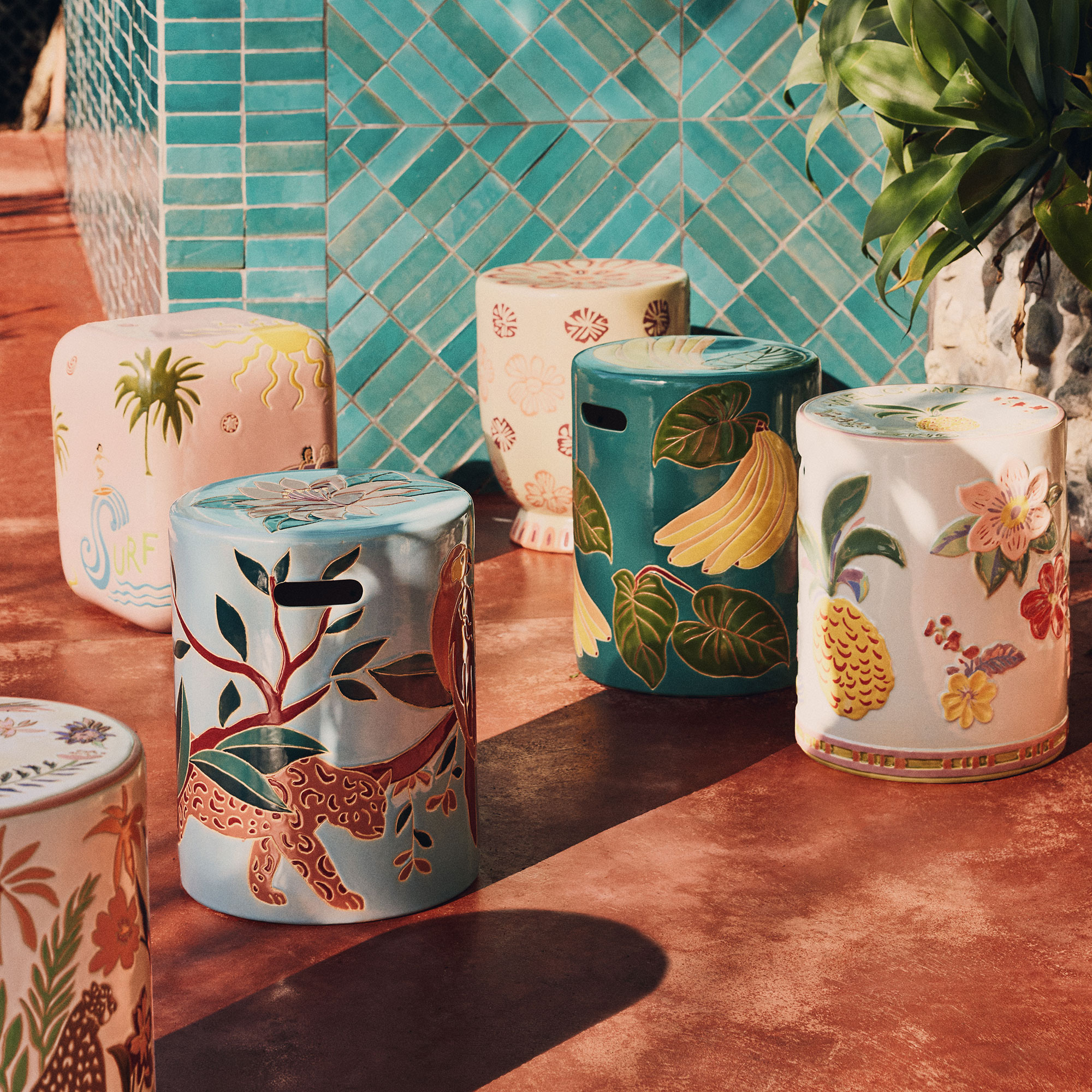 Colourful, tropical ceramic side table in sunlight on terrace