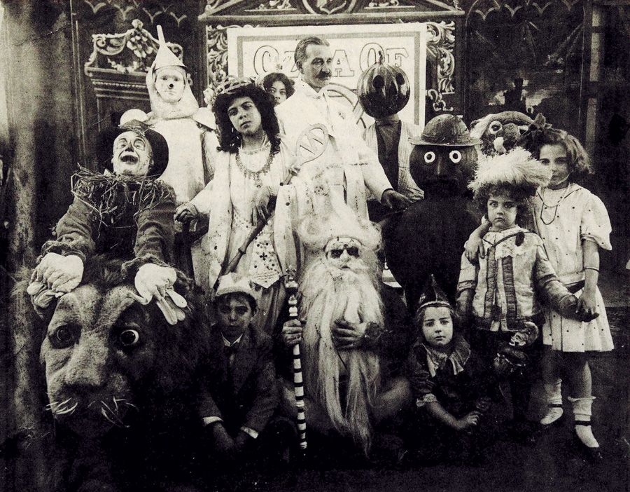 L. Frank Baum (center) surrounded by characters from The Fairylogue and Radio-Plays, a traveling multimedia Oz stage show. Circa 1908.