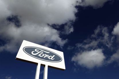 A Ford sign above a head office