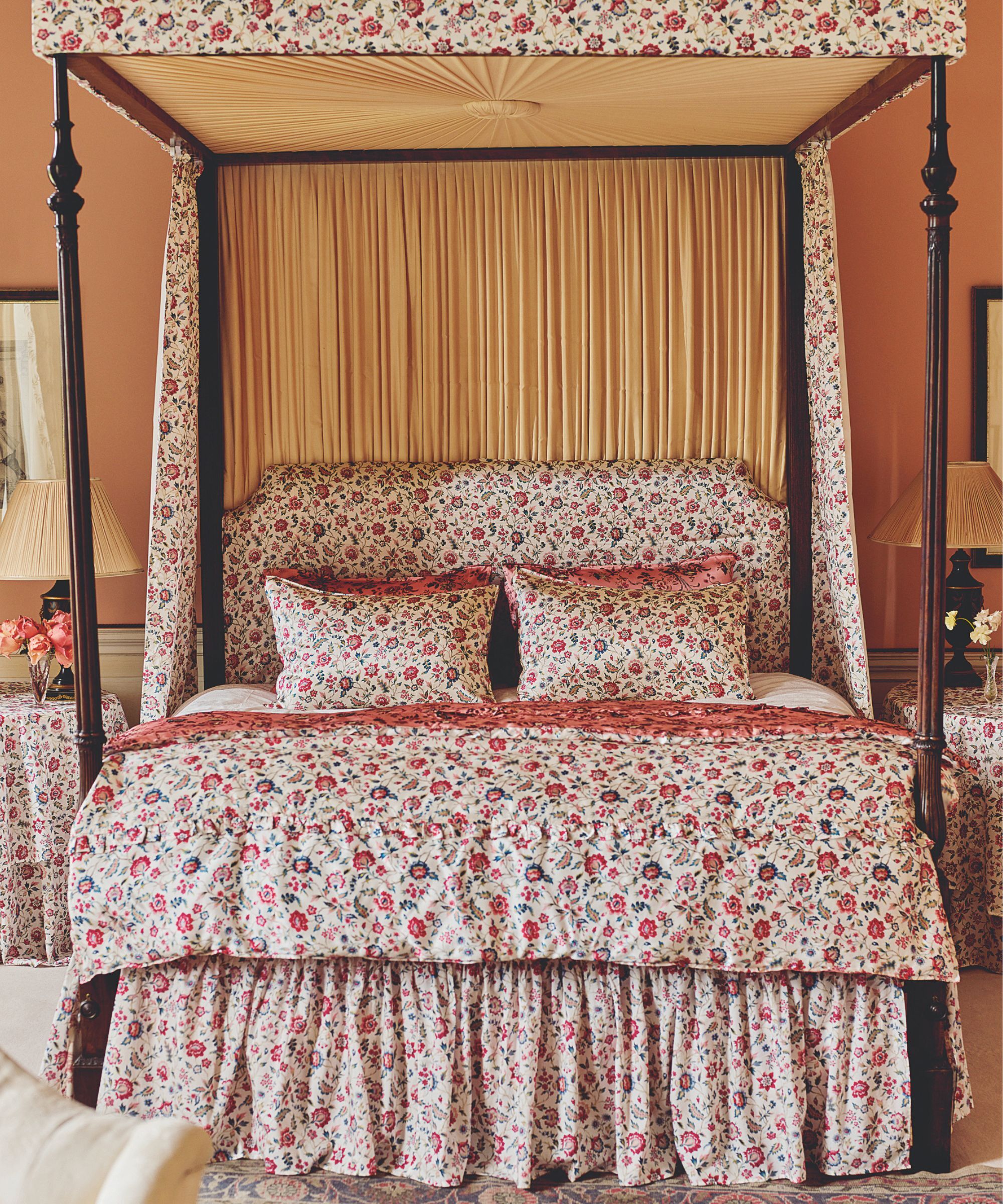 Traditional ditsy floral print bedding by Liberty on a four poster bed