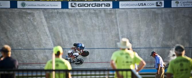 Volunteers from the Giordana Velodrome watch as Bobby Lea (top) passes Liam Donohghue (bottom) in the Men's Individual Pursuit