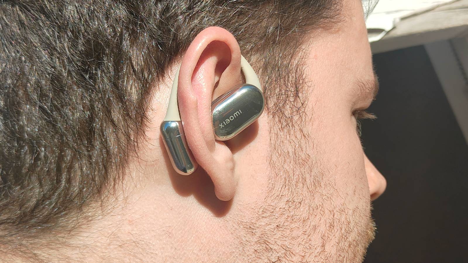 The Xiaomi OpenWear Stereo Pro in a sunny outdoor setting.