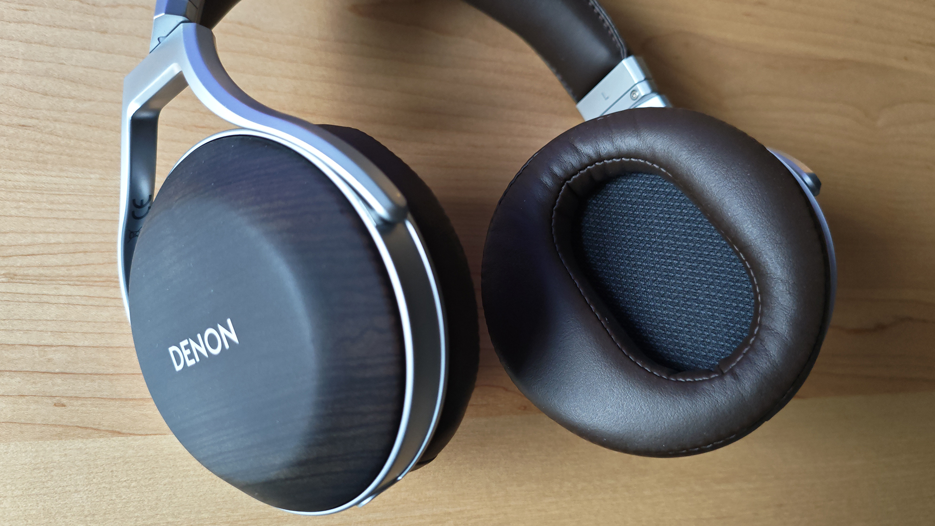 The Denon AH-D5200 and other headphones, photographed on a home desktop. 