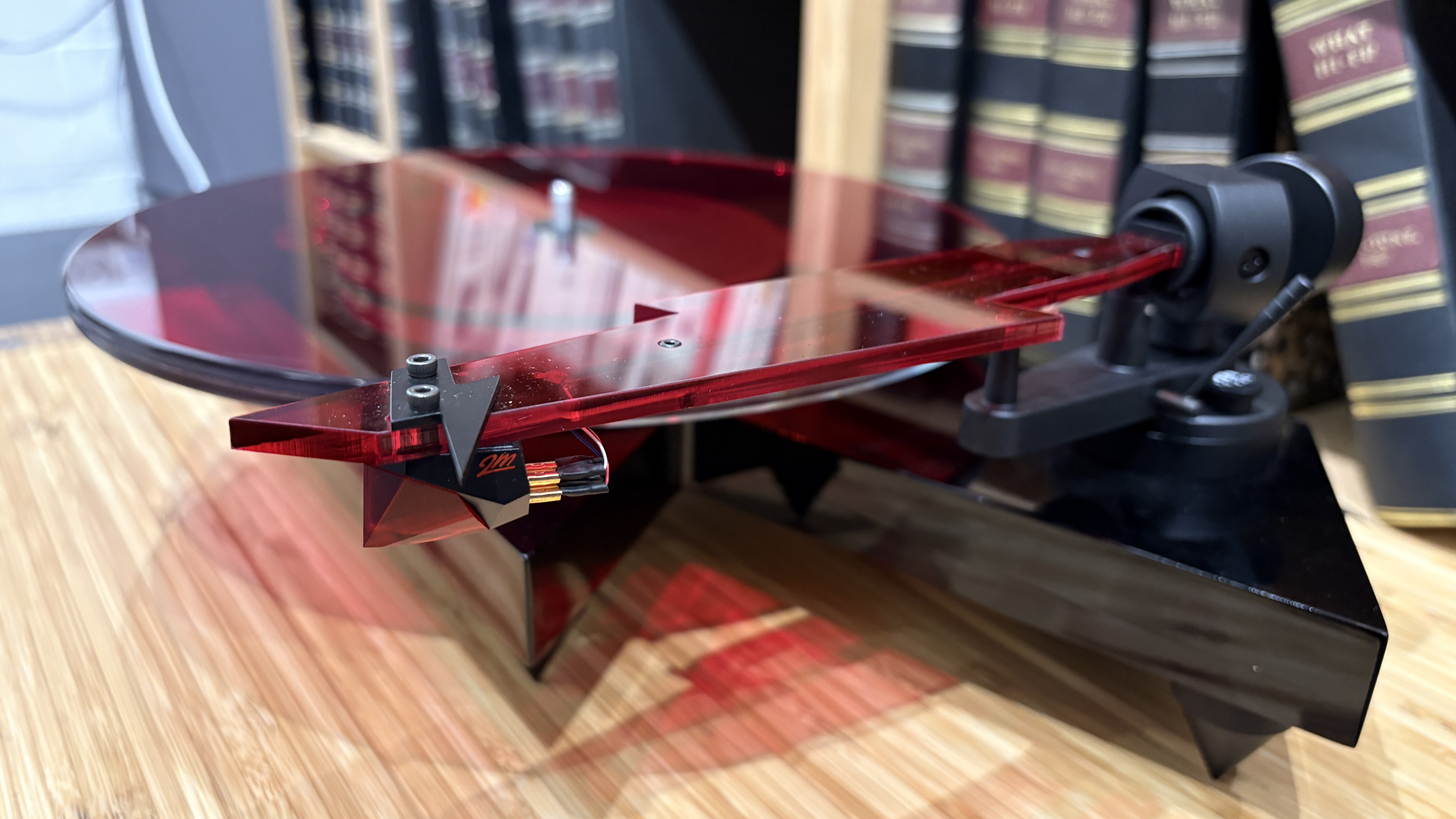 Pro-Ject AC/DC Turntable on wooden hi-fi rack