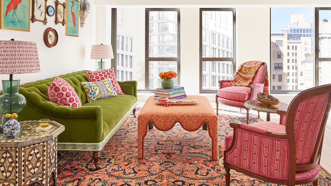 colorful living room with green sofa, pink armchair and salmon pink coffee table