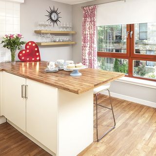 kitchen with breakfast bar and wooden flooring