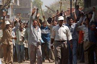 A Hindu mob wielding sticks and metal tools in Ahmadabad, India