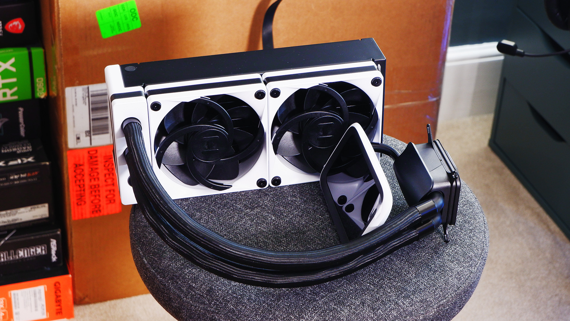 Hyte's Thicc Q60 liquid cooler with a huge 5-inch screen on the cold plate.