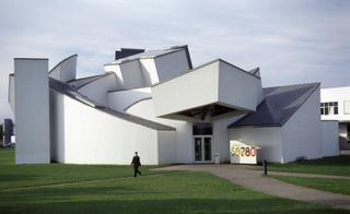 The Vitra International Furniture Manufacturing Facility and Design Museum. A white building with sections jutting out of it at angles.