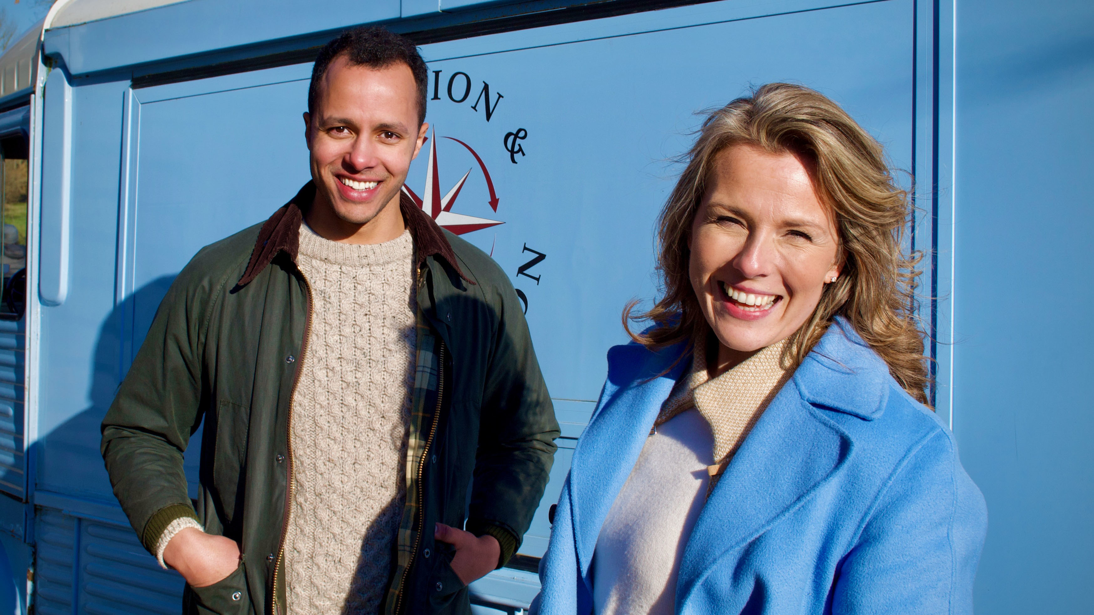 Will Kirk and Christina Trevanion pose in front of their new blue van for The Travelling Auctioneers