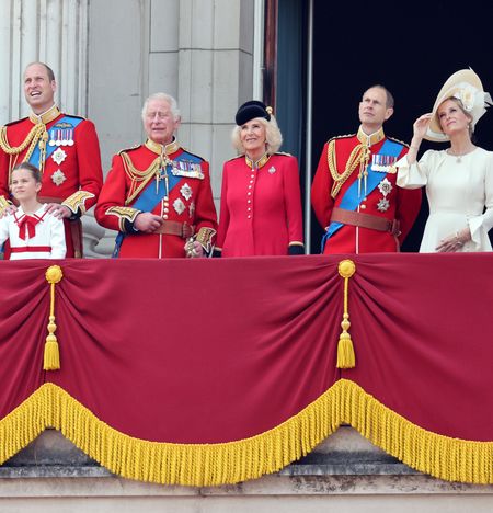 The King, Queen and other members of the royal family in dresses and military uniforms on the balcony at Buckingham Palace during Trooping the Colour 2023