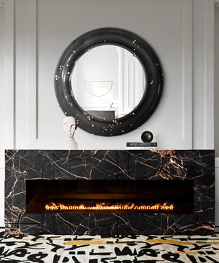 Entryway modern fireplace with marble surround and round black framed mirror
