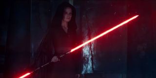 Daisey Ridley as Rey in Rise of Skywalker with a red lightsaber