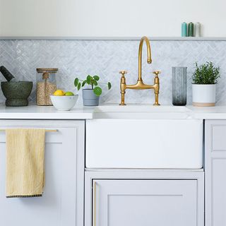 kitchen with white cabinet with sink