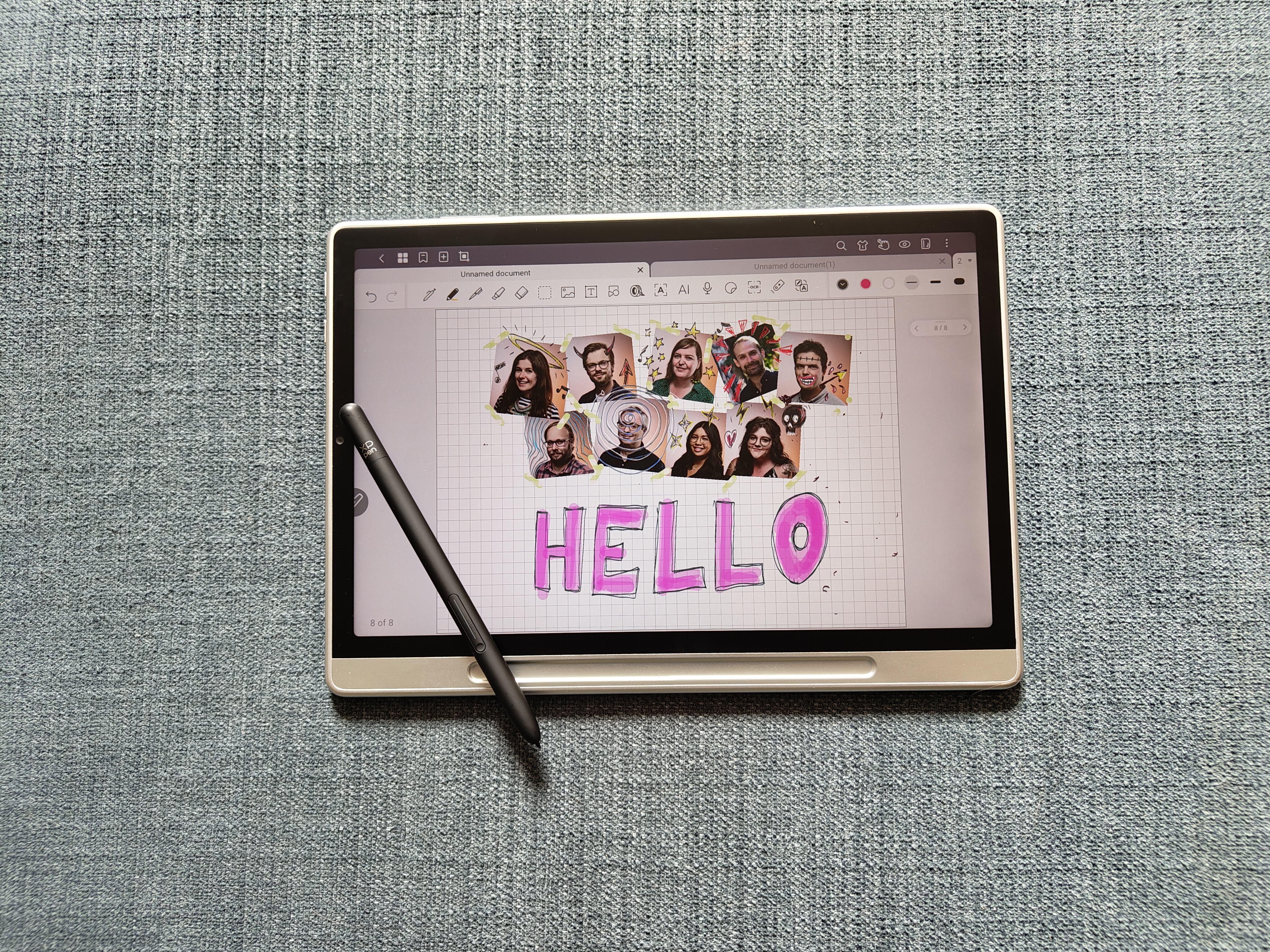 XPPen Magic Note Pad review; a tablet on an chair, a stylus, and on its display photos of people and doodles
