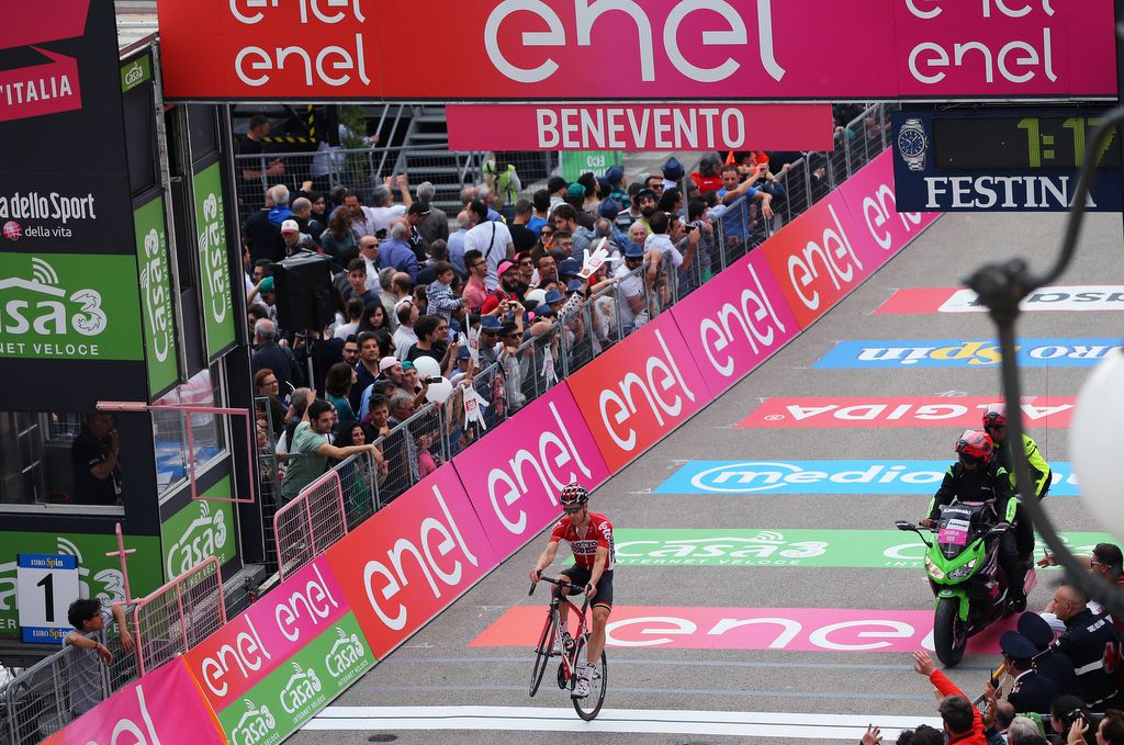 Jurgen Roelandts (Lotto Soudal) celebrates teammate Greipel winning the stage by popping a wheelie over the finish line