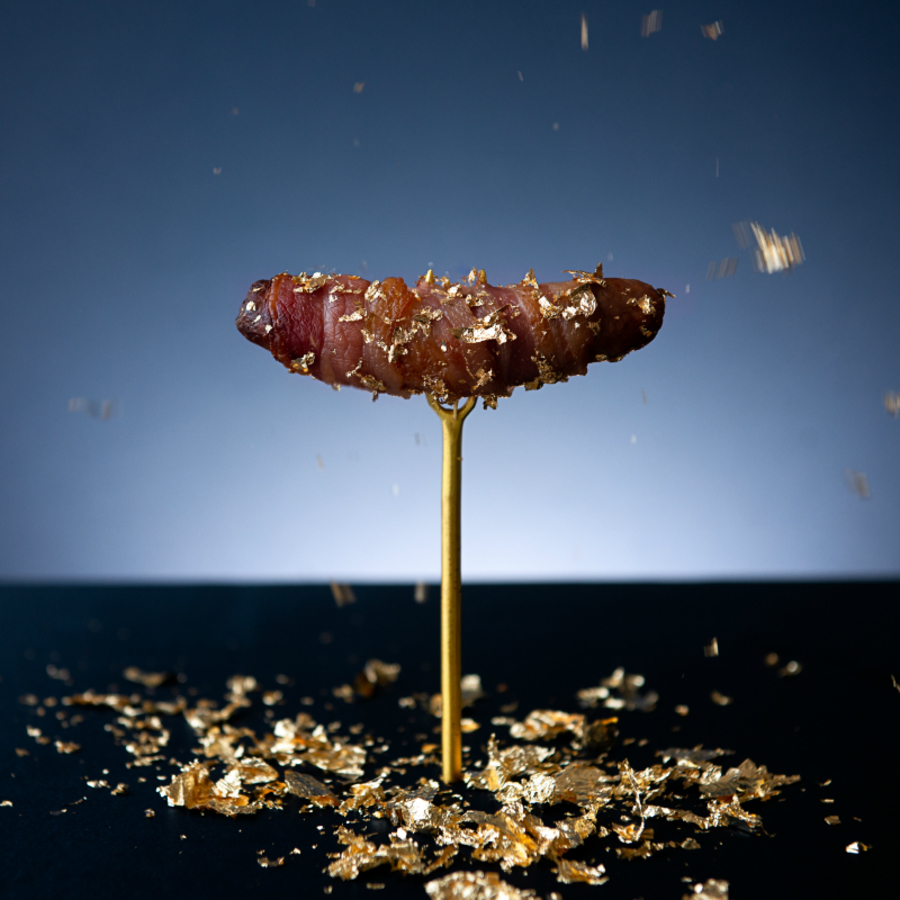 You can now buy pigs in blankets that are covered in gold