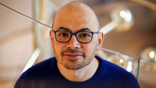 Demis Hassabis smiling after receiving the Nobel Prize.