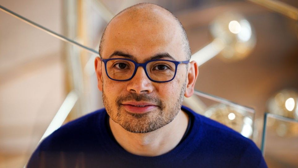 Demis Hassabis smiling after receiving the Nobel Prize.