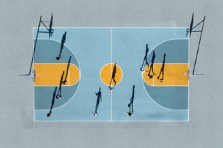 An aerial photo of people playing on a basketball court