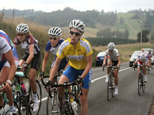 Alexandra Carle climbs in the leader's jersey on the final stage.