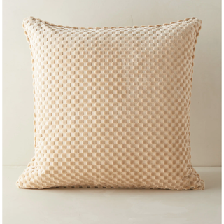 beige pillow in a velvet check print design