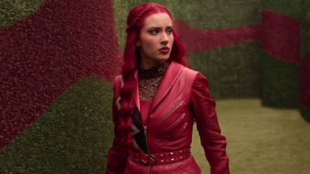 Kylie Cantrall walking in a maze in Descendants: Wicked Wonderland. 