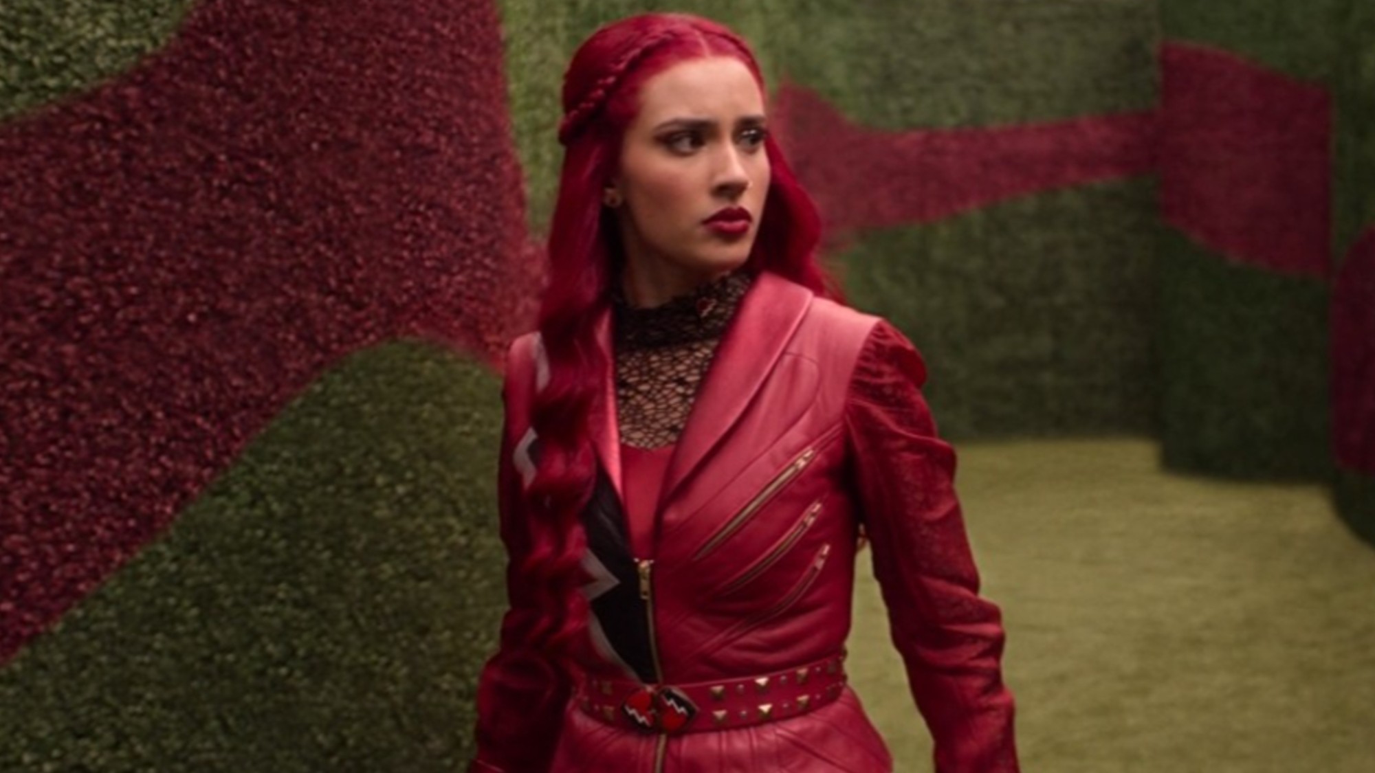 Kylie Cantrall walking in a maze in Descendants: Wicked Wonderland. 