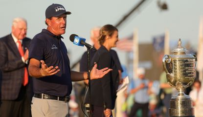 Mickelson poses with the trophy