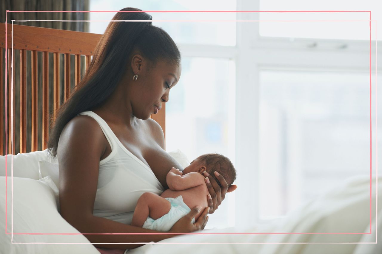 A woman breastfeeds her baby