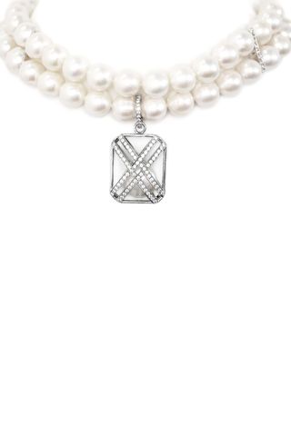 strand of pearls with silver charm