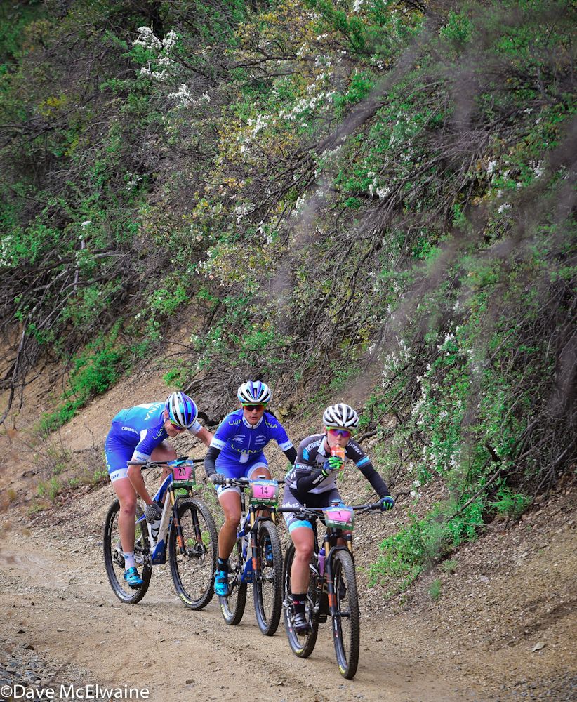 Chloe Woodruff (NoTubes Niner) approaching the top of the first climb with Katerina Nash and Georgia Gould in tow