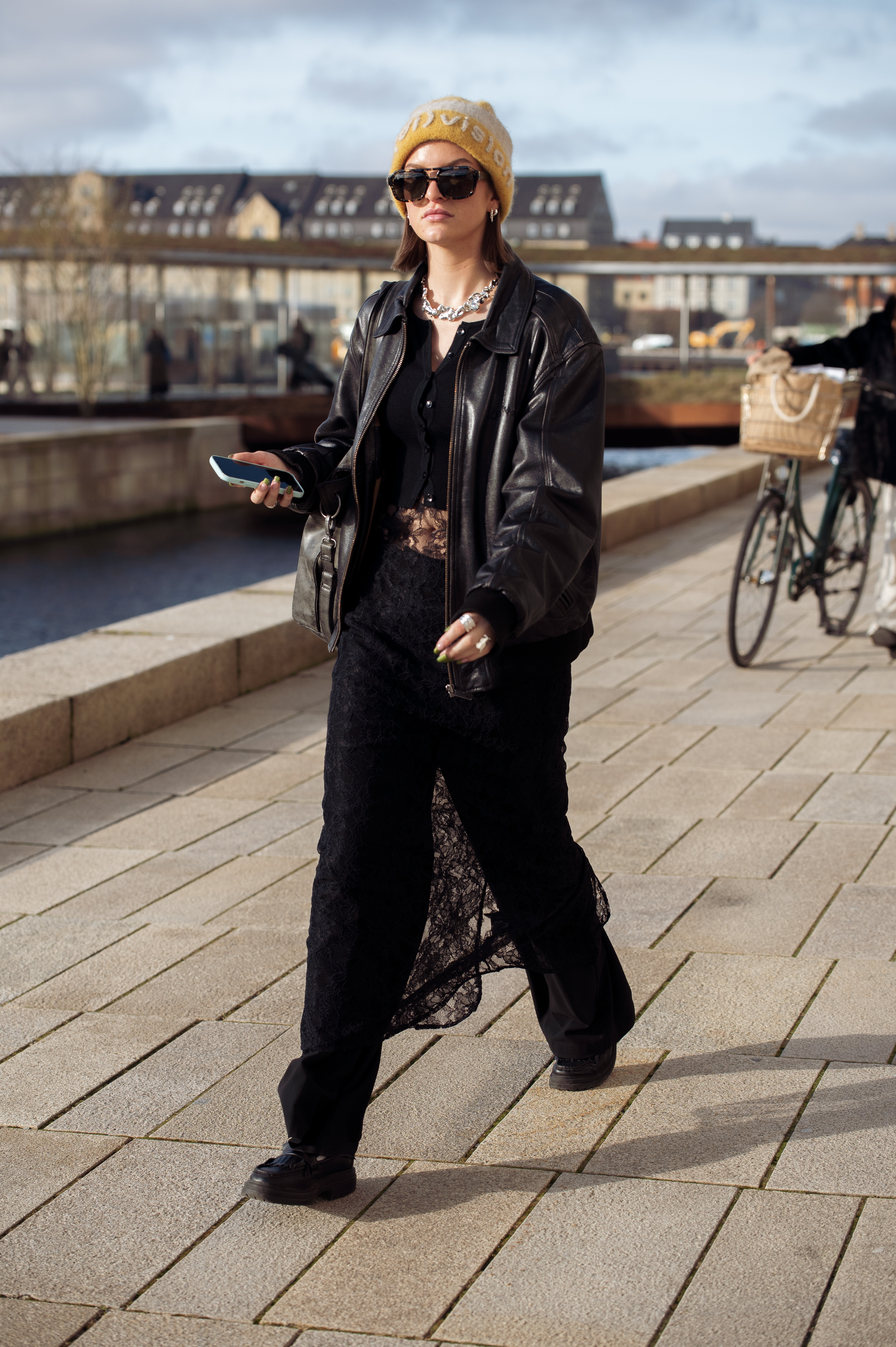A model channeled Jennifer's skirt over pants hack during Copenhagen Fashion Week