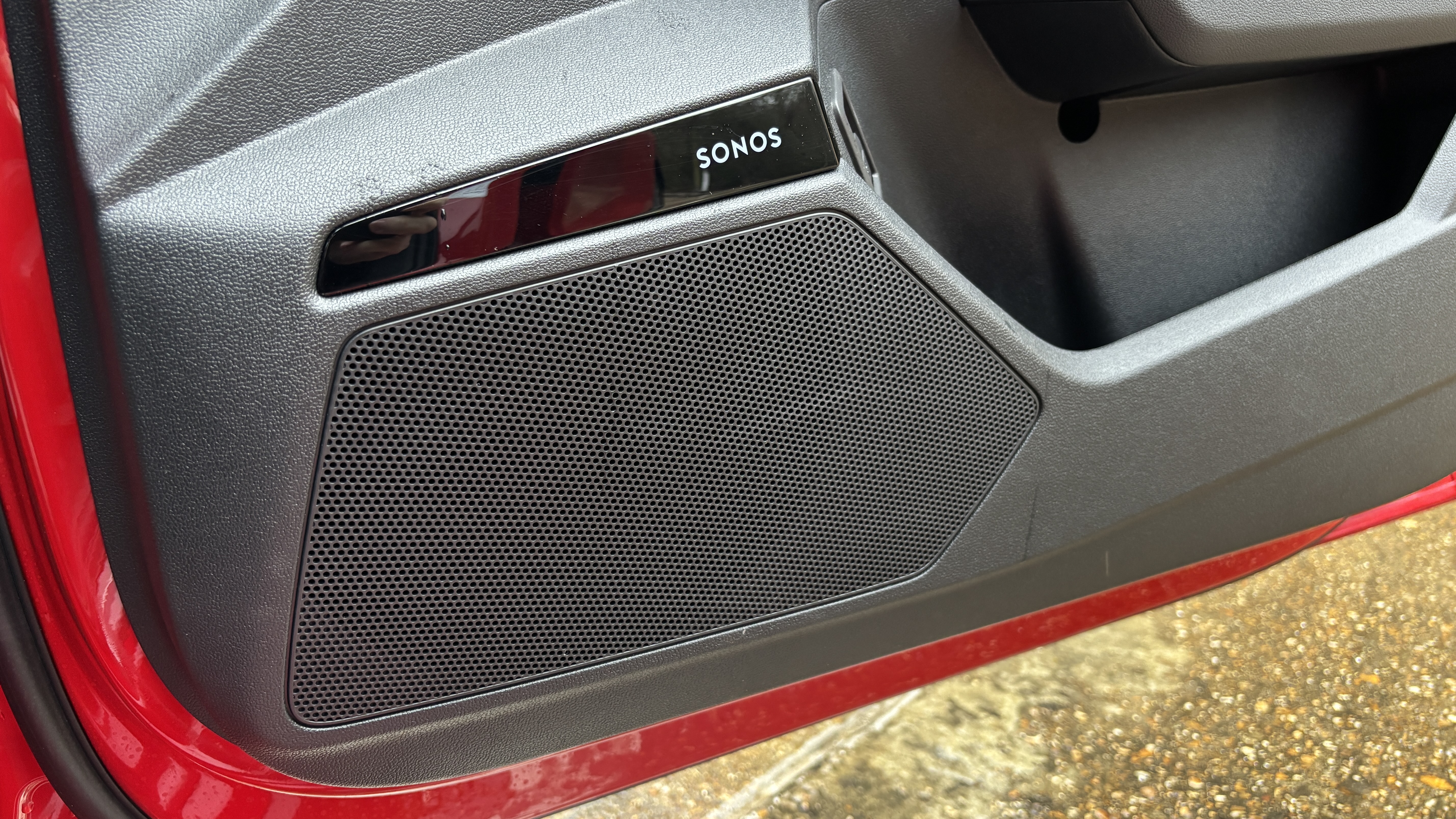 Sonos speaker and speaker grille in the door of an Audi A3