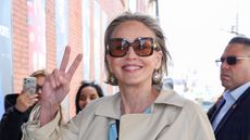 Sharon Stone wearing a trench coat