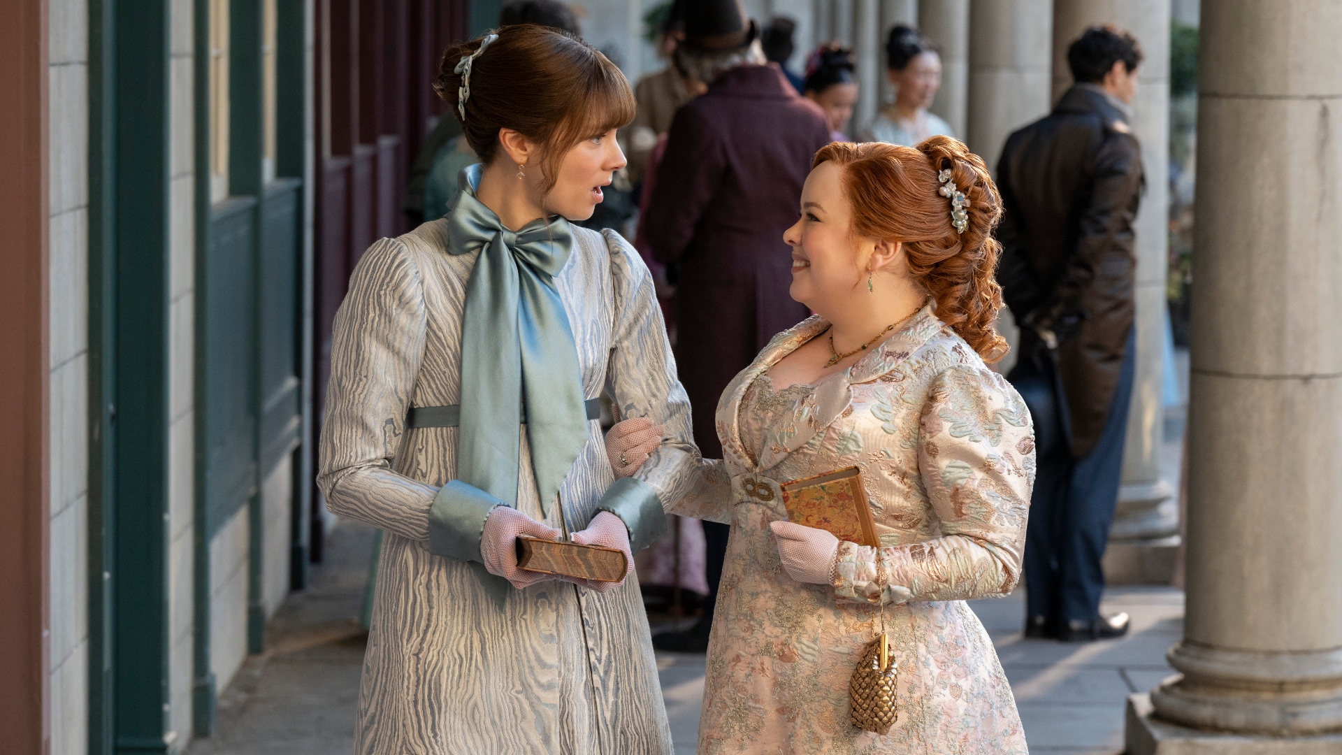 Eloise looks shocked as Penelope smiles in Bridgerton season 4