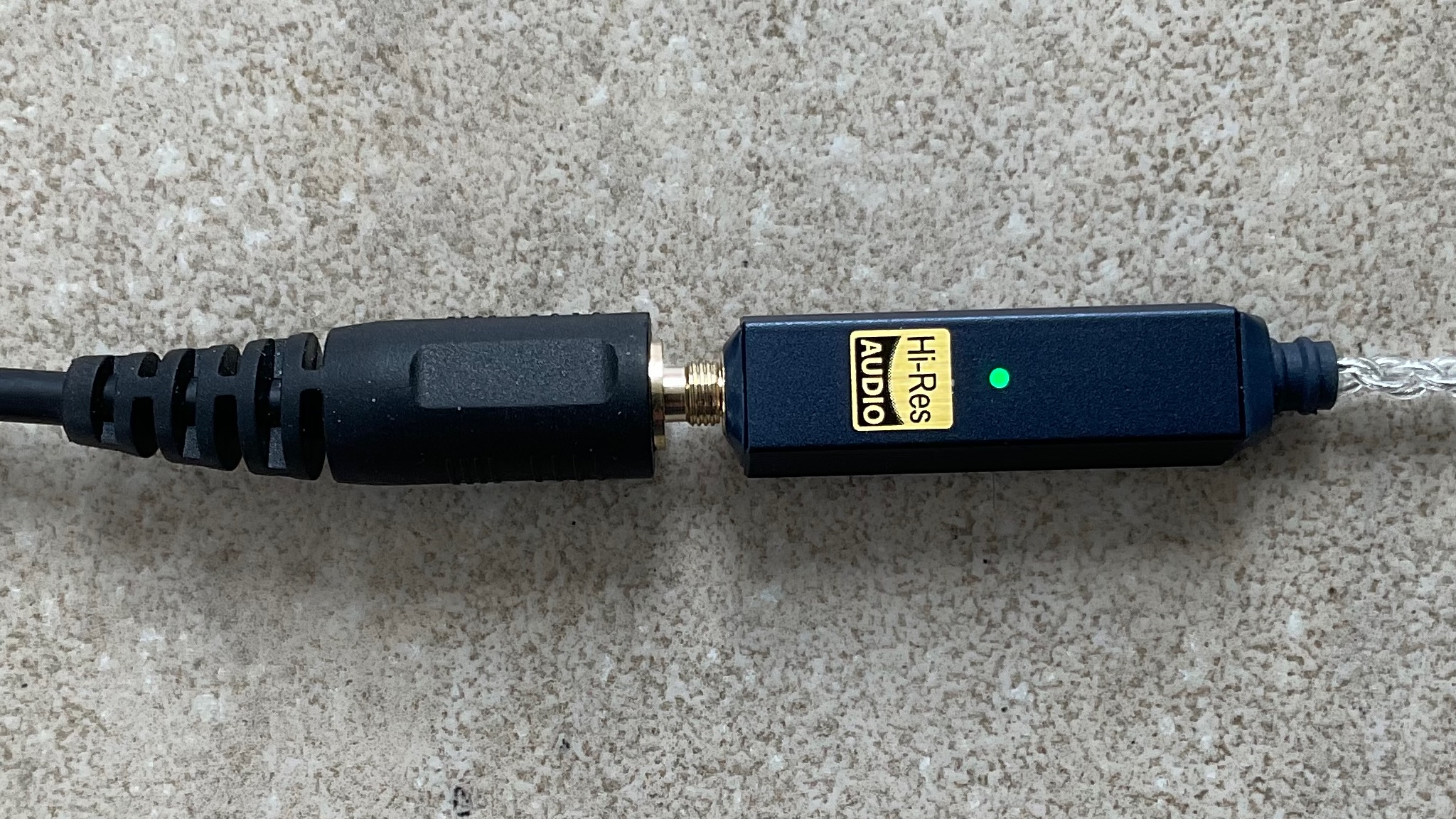 iFi GO Link 2 shot on a grey surface
